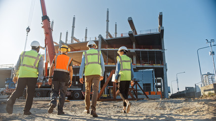 Diverse Team of Specialists Inspect Commercial, Industrial Building Construction Site. Real Estate...