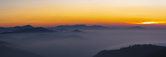Fototapeta na wymiar Sunset over the mountains in the Aiako Harriak Natural Park, Euskadi