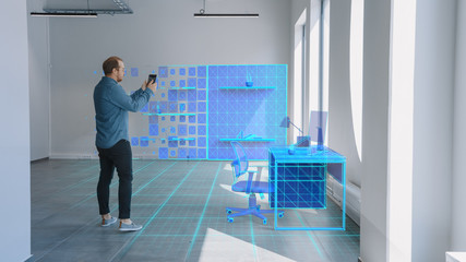 New Home Office: Modern Interior Designer Uses Augmented Reality Software on Digital Tablet...