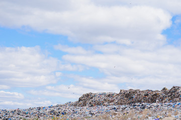 Fototapeta na wymiar Scrap heap - Scrap Metal ready for recycling with blue sky