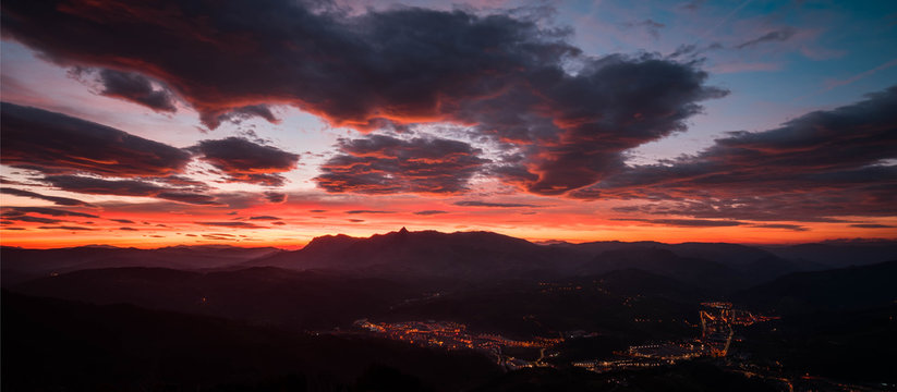 Mountains, golden sunrise and clouds. Sunrise in Aralar and Ordizia seen from Usurbe.