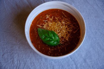 Homemade tomato soup with parmesan cheese