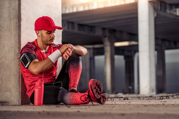 Athletic man resting after training