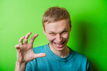 young man trying to scare someone