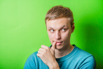 Worried  man nibbling his fingernails