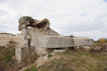the ruins of german bunker in the beach of Normandy, France