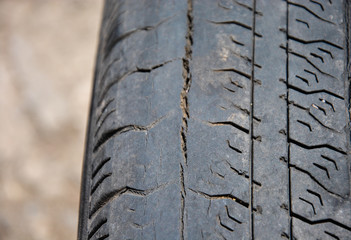 Fototapeta premium tire wear. damaged tire. old tire blurred background