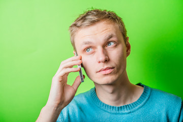 Handsome man talking at the phone