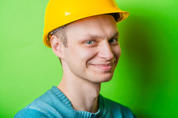 young man in a yellow helmet smiling