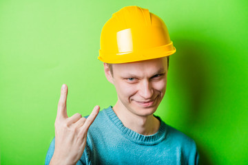 construction worker showing heavy metal rock-n-roll sign