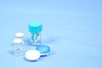 Contact lens case. Close-up of the contact lens disinfection container with cleaning solution. space for text, selective focus