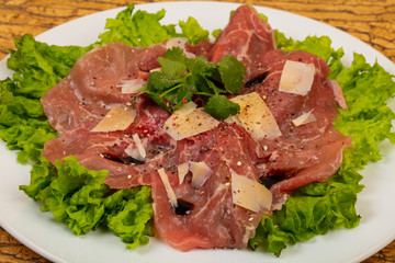 Beef carpaccio with parmesan cheese