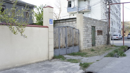 Fototapeta na wymiar wrought iron gates in front of the house