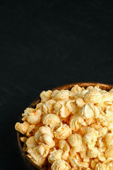 Popcorn. Cheese and caramel popcorn on a dark background. Top view copy space.
