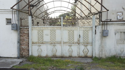 wrought iron gates in front of the house