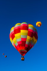 Balloons Aloft For Early Morning Mass Ascension at The  Albuquerque International Balloon Fiesta, Albuquerque, New Mexico, USA