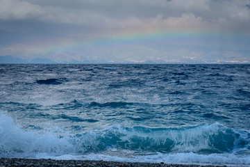 sea, clouds and rainbow