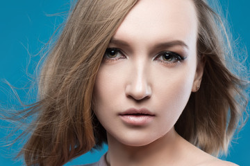 Naklejka premium Beautiful woman face close up studio on white