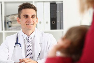 Obraz premium Little child with mother at pediatrician reception. Physical exam, cute infant portrait, baby aid, healthy lifestyle, ward round, child sickness, clinic test, high quality and trust concept