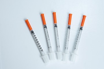 nsulin syringes on a white background