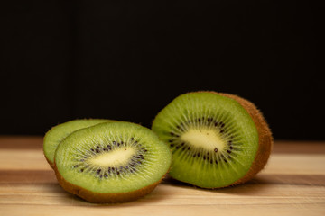 Sliced kiwi on wooden table