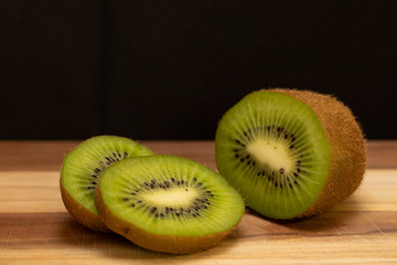 Sliced kiwi on wooden table