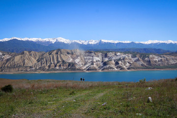 Toktogul Reservoir and Tian Shan mountains view by spring, Kyrgyzia