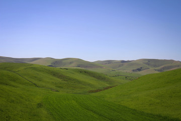 Fototapeta na wymiar Calm green hills landscape near Jalal-Abad by spring, Kyrgyzia