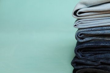 pile of blue jeans