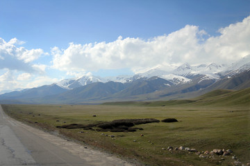 Too Ashuu mountain pass scenic view by spring with white peaks, Kyrgyzia