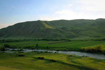 Fototapeta na wymiar Scenic bright view of Torkent River by spring, Central Kyrgyzia