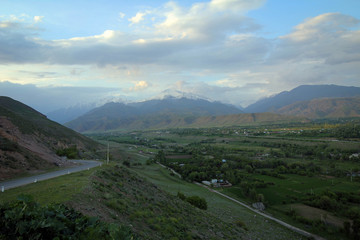 Scenic misty summer landscape near Karakol town, Kyrgyzia