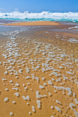 Queen's Pond Draining Into The Pacific Ocean at Low Tide on  Polihale Beach, Polihale Beach State Park, Kauai, Hawaii, USA