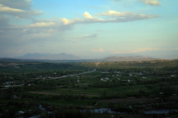 Scenic misty summer landscape near Karakol town, Kyrgyzia