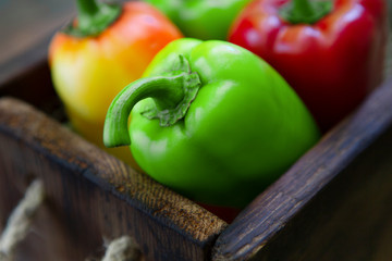 Fresh and clean sweet pepper in vintage wooden box