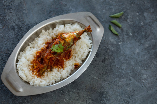 fish curry with rice, indoor lighting setup