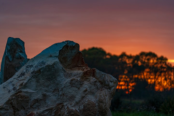 Big rock against the sunset sky