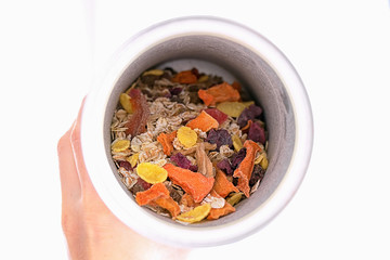 Muesli with flakes and chips vegetables and fruits in a box