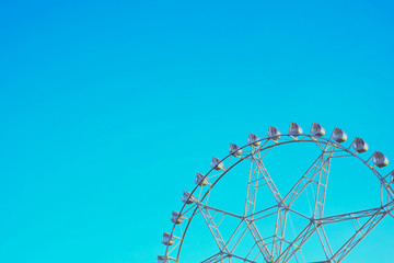 ferris wheel on a blue sky