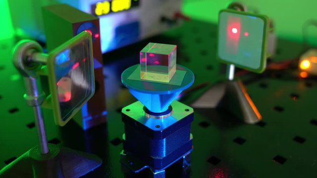  laser in a quantum optics lab. Semiconductor laser on optical table in a quantum physics optics lab.