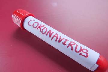 blood test tube on red background, positive test coronavirus covid-19