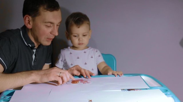 father deals with the child, child education, lessons with a child, home study