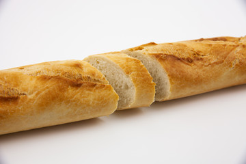 Freshly baked cut bread on a white background. For the presentation of food products, bread production and basic necessities.