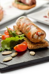 gourmet salad cannelloni on white background