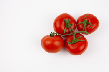 Isolated red, fresh and juicy tomatoes on a white background. Vegetables for fresh salad.