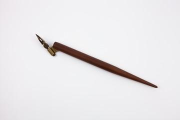 Calligraphy ink pen on a white background