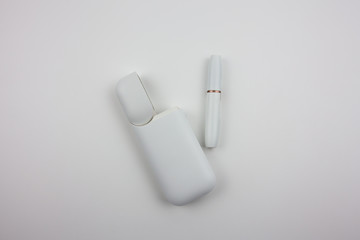 Electronic cigarettes in a white case. For the presentation of tobacco products and the work of the tobacco industry.
