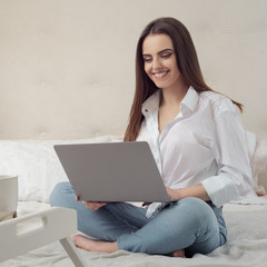 Girl working from home on laptop during Covid-19 lockdwon