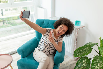 Woman taking a selfie with smart phone