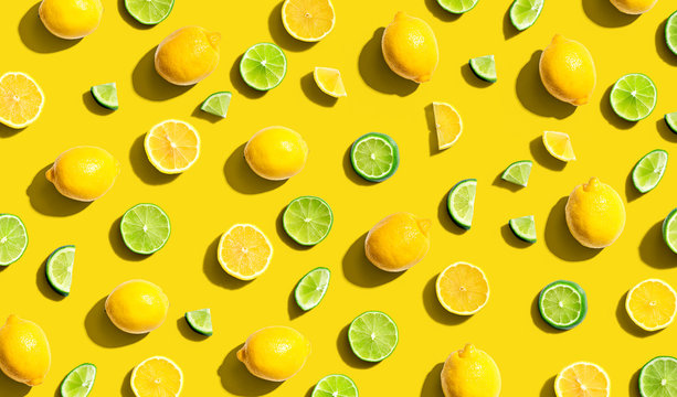 Fresh lemons and limes overhead view - flat lay